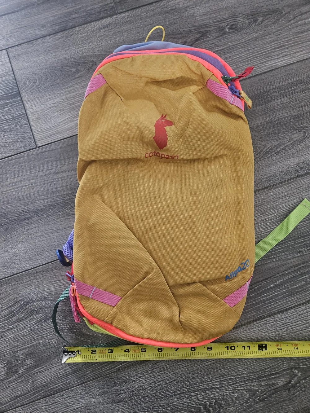 cotopaxi Allpa Daypack in mustard yellow with pink and purple accents